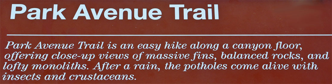 sign about the Park Avenue Trail at Arches National Park